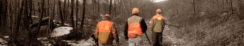 men in orange vests hunting