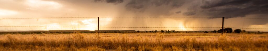 storm clouds over farm land