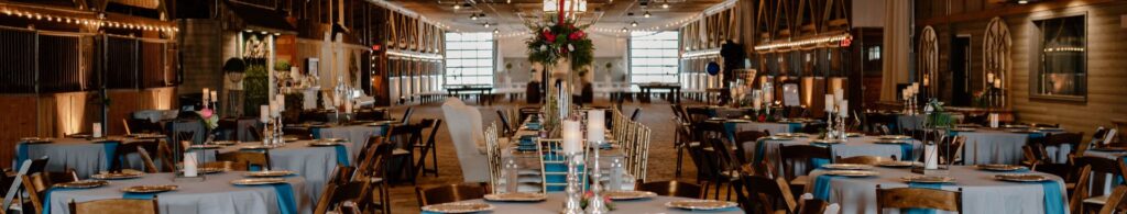 wedding tables inside barn