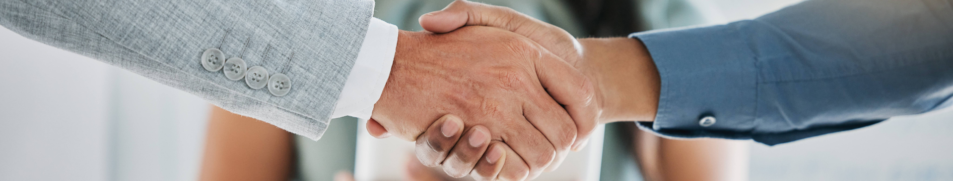 Image of a handshake in a business setting