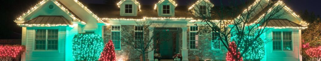 House with white, red, and green holiday lights
